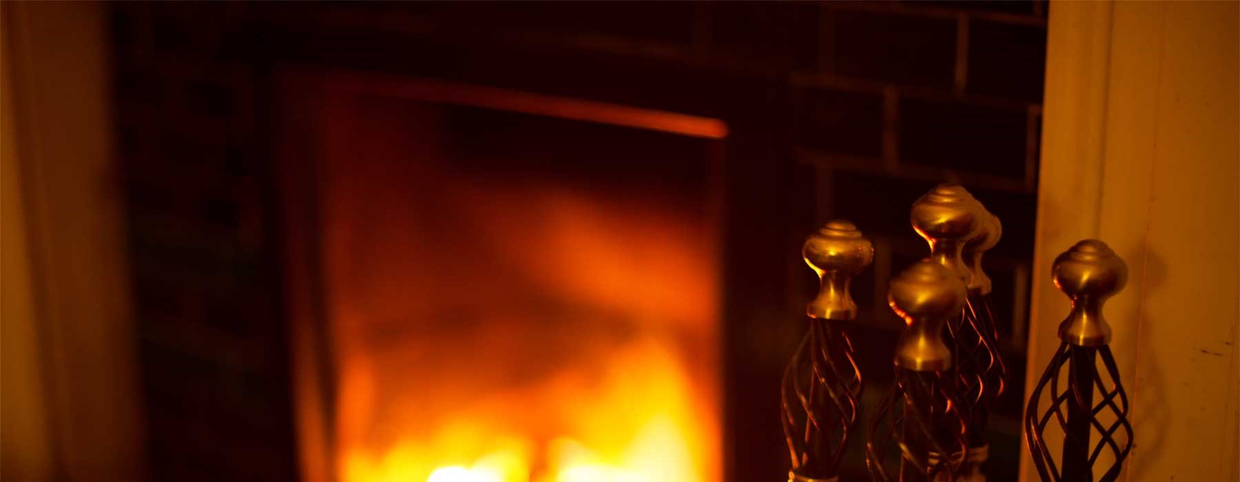 Lit fire under a chimney