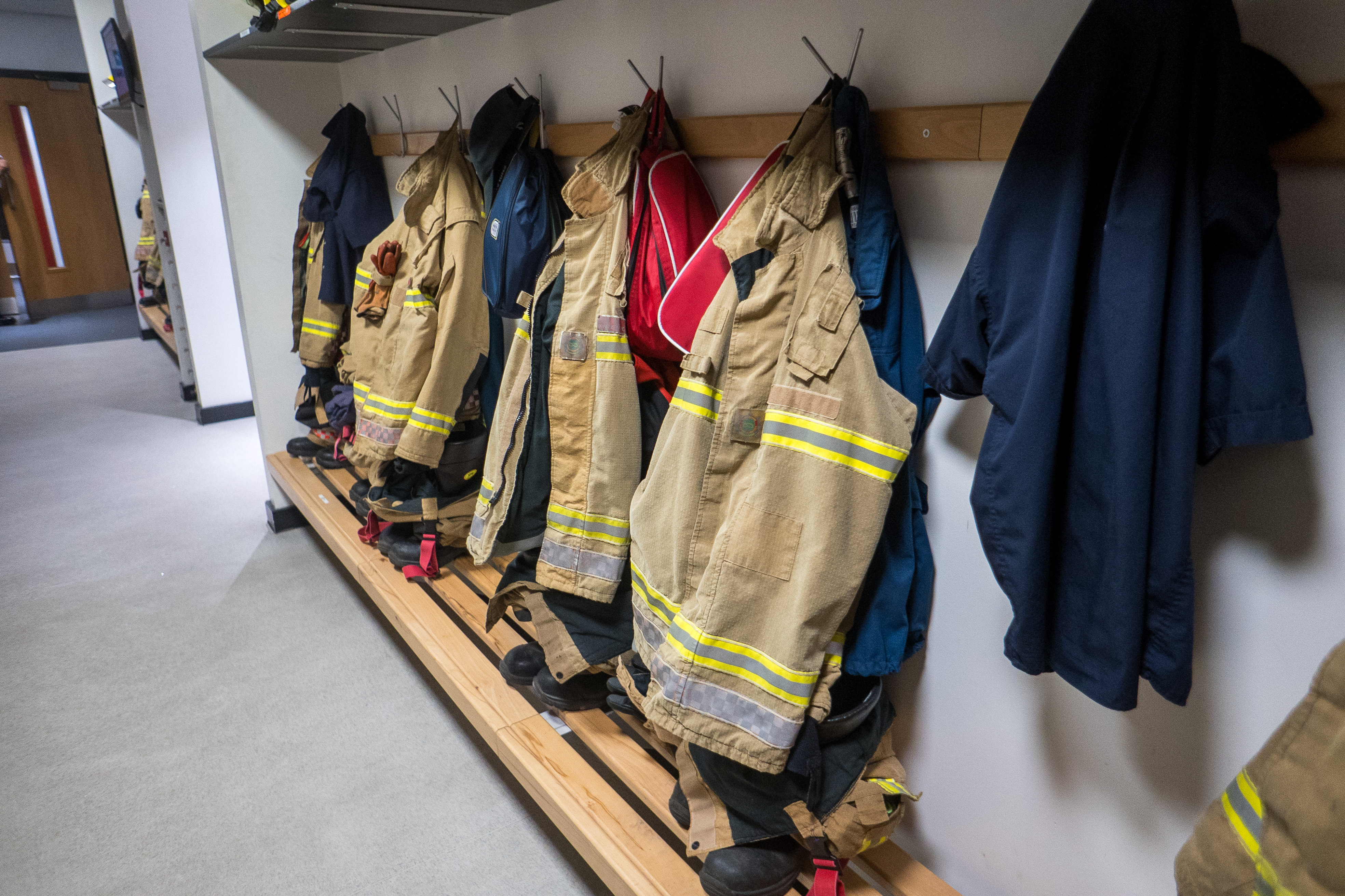 Uniforms hung up on pegs