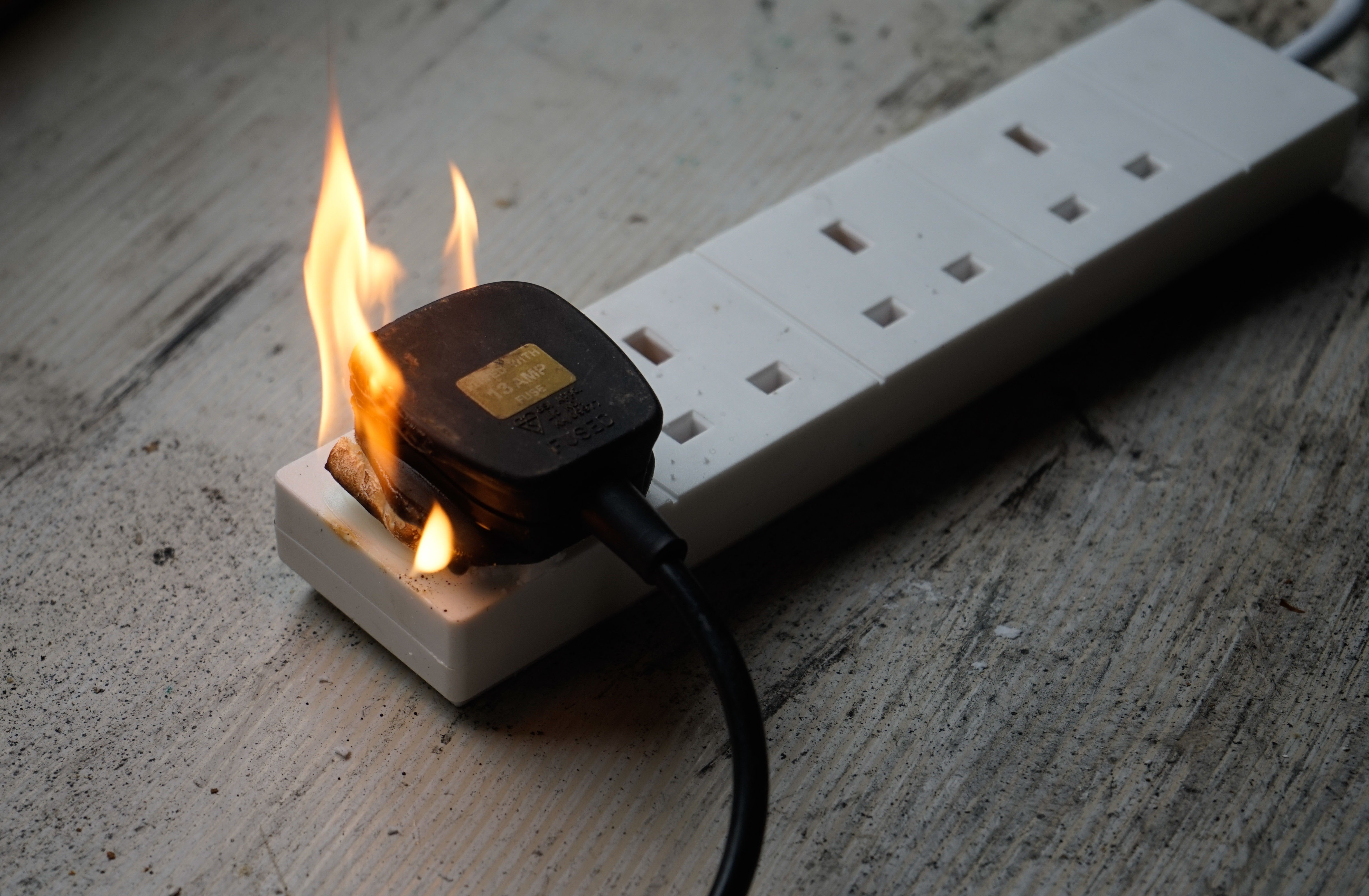 Electrical plug adapter on fire