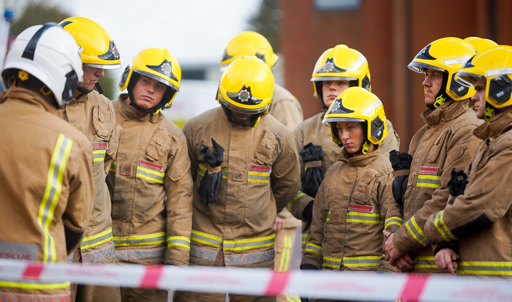 Firefighters listening to instructions
