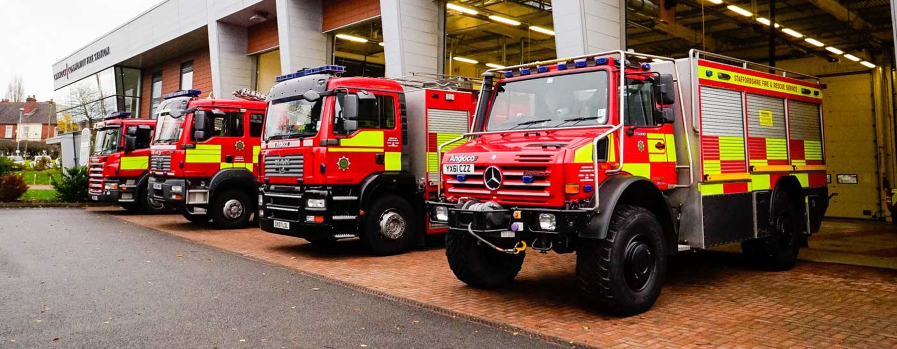 Service vehicles lined up outside appliance bay